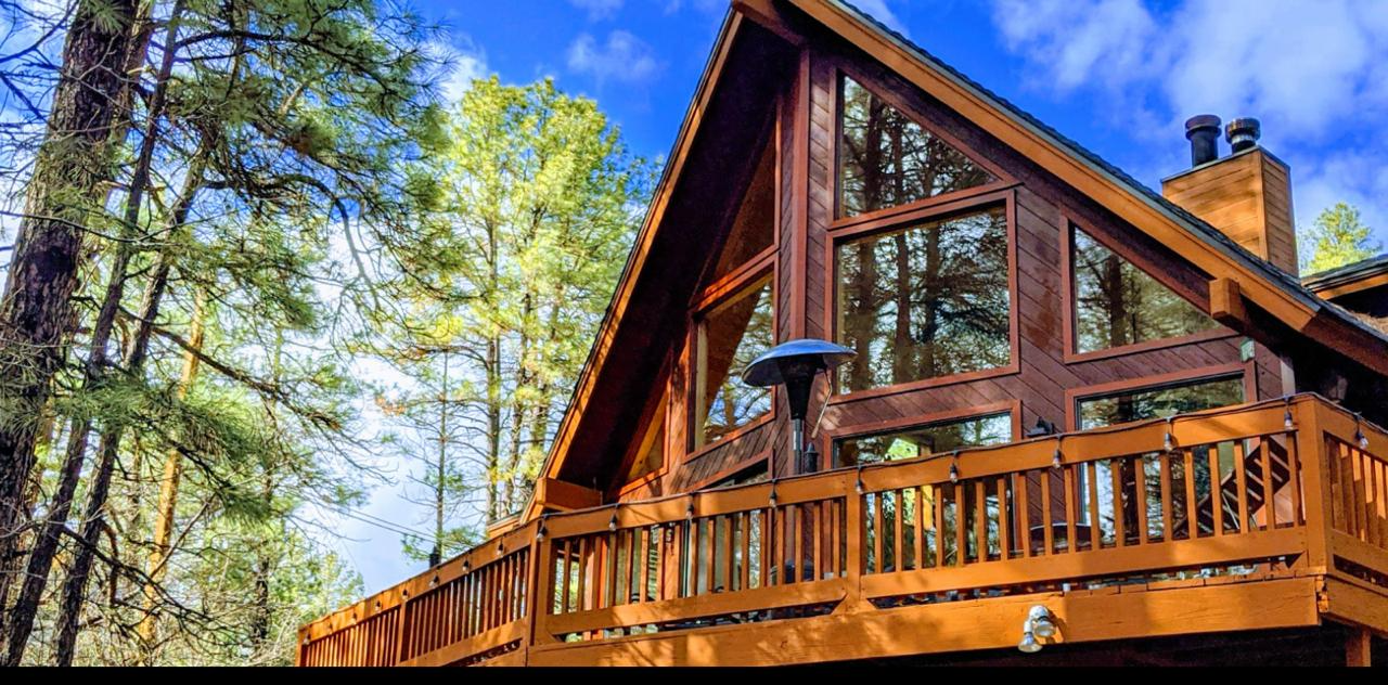 a view the A-frame from the back yard of Wandering Elk Cabin in Pine